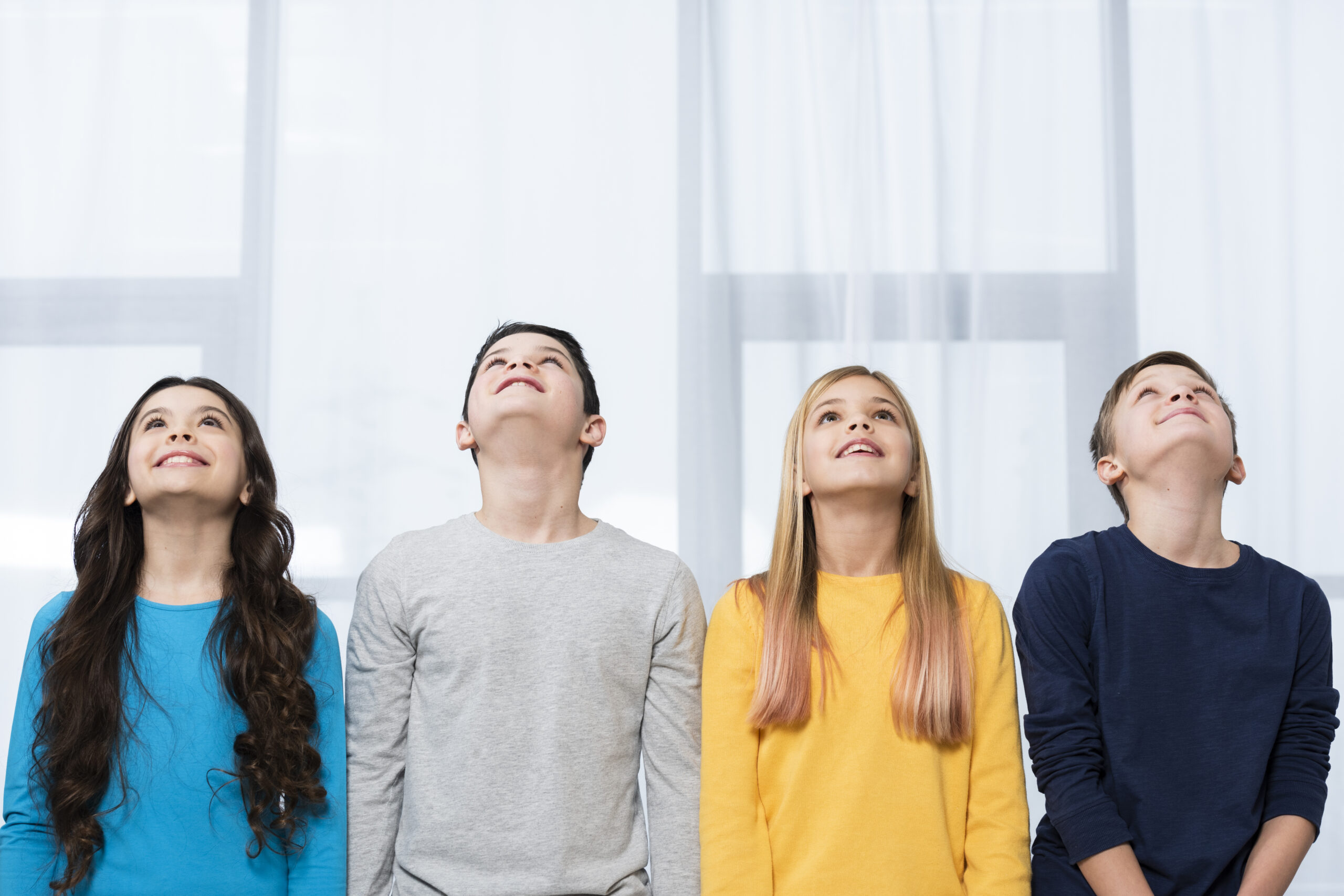 low-angle-kids-looking-up